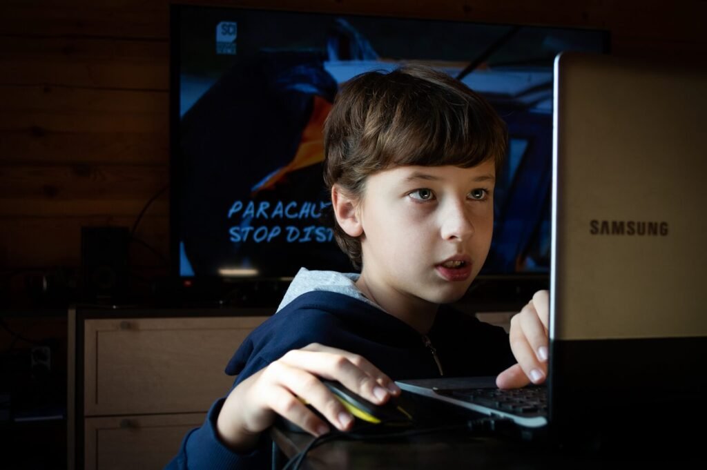 kid using screen device