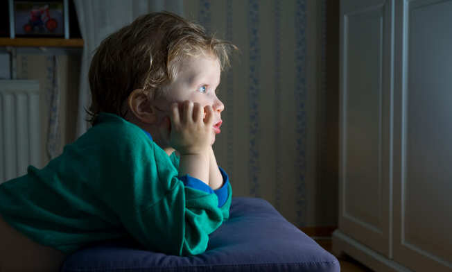 Kid in front of screen