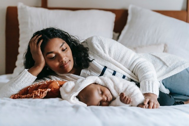 mom sleeping with baby